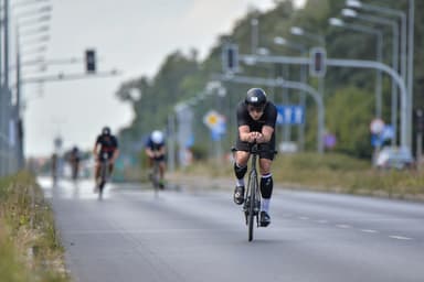 Christian Plesca on the time trial bike on a closed road on the bike course.