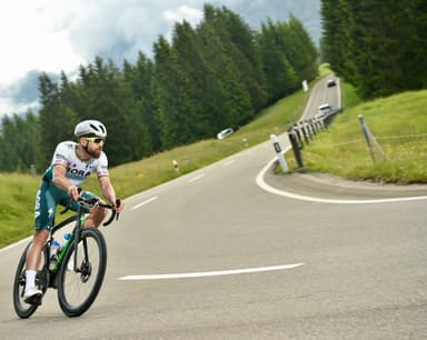 Christian Plesca descending an alpine road on the road bike.