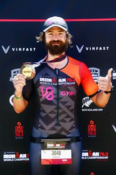 Christian Plesca with the finisher medal at the IRONMAN 70.3 World Championship.