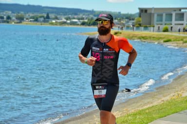 Christian Plesca on the run course beside the lake at the IRONMAN 70.3 World Championship.